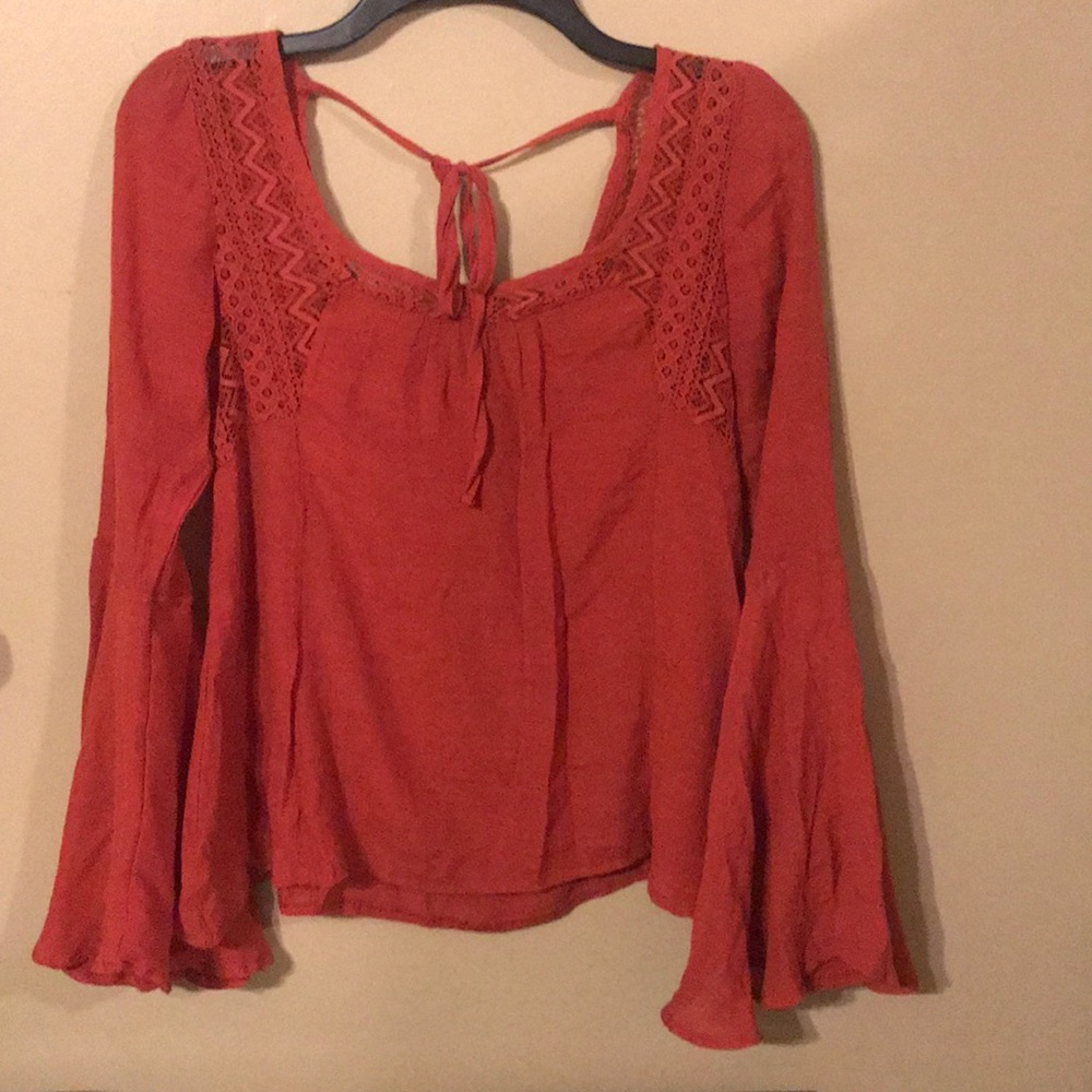 Ladie’s bell sleeve orange top w/lace